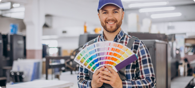 man-working-printing-house-with-paper-paints